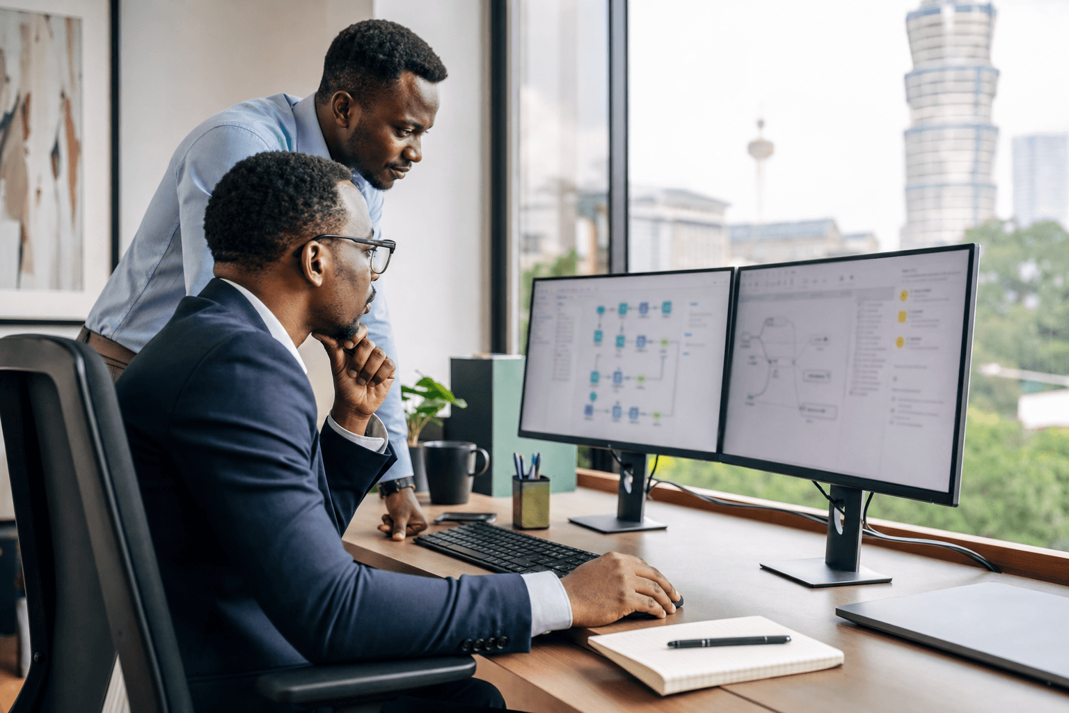 East African operations professionals reviewing an automation workflow